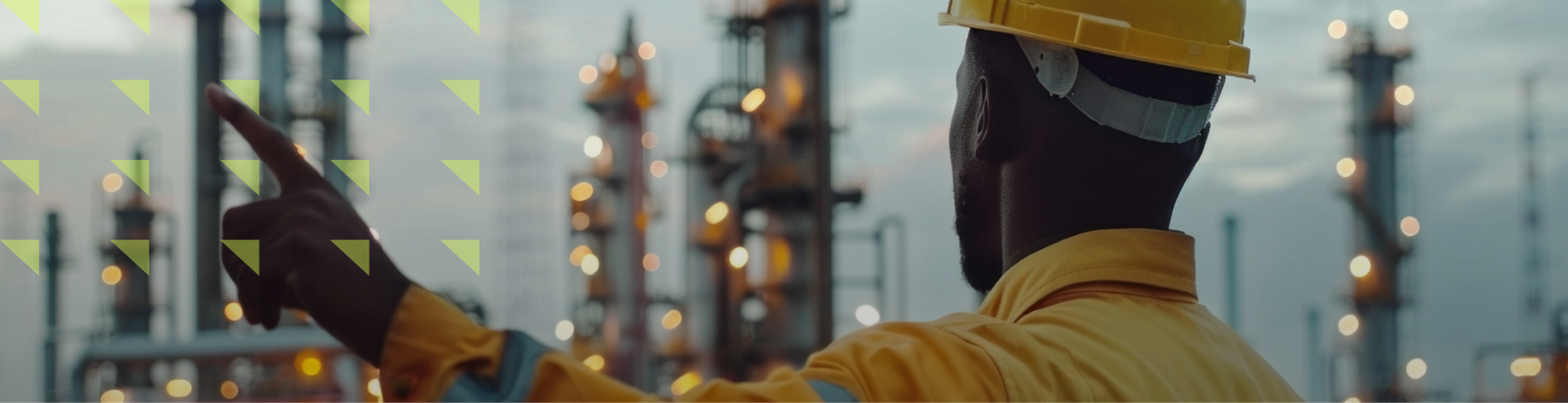 Engineer pointing at an oil refinery